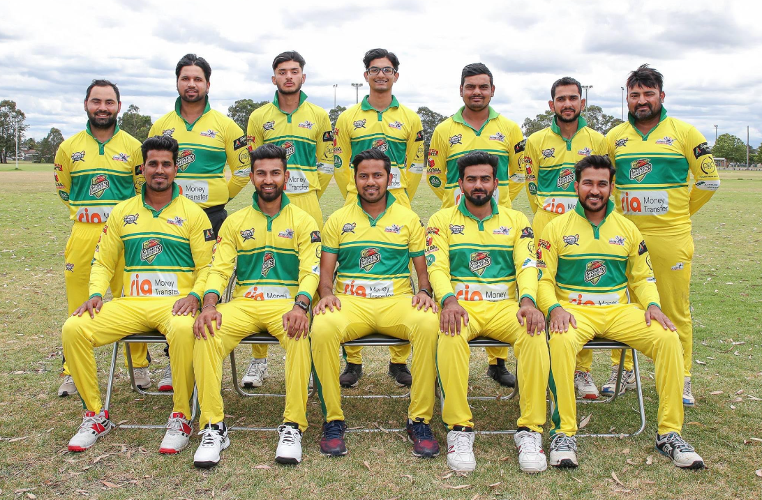 Sydney Chargers team photo in yellow and green kit